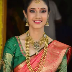 A beautiful portrait of Pragati for her engagement. I created a soft glam look with pink lipstick and subtle eye makeup that harmonized with her pink and green Kanchipuram silk saree.