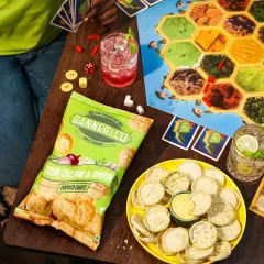 Game night is on, and the snacks are the MVP. We styled this shot to feel like a real, in-progress game of Catan, integrating the chips and drinks naturally into the scene. This lifestyle approach helps customers envision the product as part of their own fun moments.
