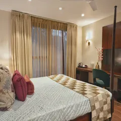 This angle shows the functional layout of the homestay bedroom, including a dedicated work desk and TV unit. We ensured that every element, from the furniture to the lighting, contributes to a cohesive and high-end guest experience.