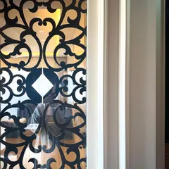 Function meets beauty in this safety door design for a Mumbai project. The intricate 'jali' pattern is not just decorative; it includes a small opening for parcels, blending traditional aesthetics with modern convenience.
