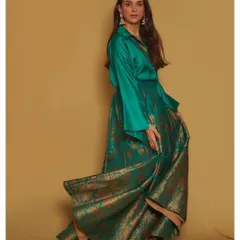 I love a powerful fusion look, and this Payal Khandwala ensemble is a perfect example. The combination of a rich emerald green silk shirt with a flowing brocade skirt is modern, regal, and guaranteed to turn heads.