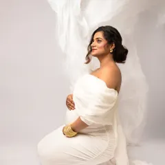 This is what I call a "fabric toss" shot. With a little help, we can make it look like the wind is catching your gown perfectly, creating an ethereal and weightless feel.