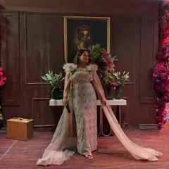 Mic in hand, ready to bring magic to the moment. A glamorous outfit and a confident stage presence are essential to hosting an elegant evening event.