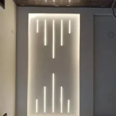 I use integrated lighting to create modern and sleek accent walls. This recessed wall panel features vertical LED profile lights, providing both ambient lighting and a strong design element.