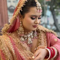A closer look at this stunning bride in her pink and gold lehenga. I gave her a classic golden nail polish on her extensions to perfectly match the intricate work on her outfit. Bridal nails are the final touch that completes the entire look.
