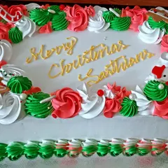 The first Christmas cake of the season. This is a fresh pineapple cake decorated with festive red, green, and white buttercream, complete with a little gingerbread man and snowman.