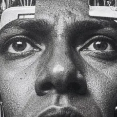 A close-up on the eyes of the 'wirehead'. The intense, grainy detail is meant to convey a sense of anxiety and data overload.