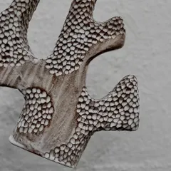 This sculptural vase is a piece of art in its own right. The intricate, hand-carved texture and organic form were created by one of our instructors to showcase advanced hand-building techniques.