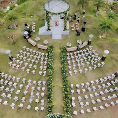 From a bird's eye view, you can see the whole story. We designed this luxe garden wedding in Udaipur to feel grand yet intimate, with a stunning circular mandap and a floral-lined aisle that created a breathtaking path to 'I do'.