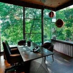 This study, cantilevered over the garden, is a true room with a view. Sheltered under the canopy of an Alistonia tree, it is a space I designed for quiet contemplation and inspiration, away from the distractions of the world.