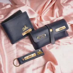 A 3-piece men's accessory set in navy blue, featuring a wallet, sunglasses case, and keychain, all personalized with a name and a "Mr." charm.