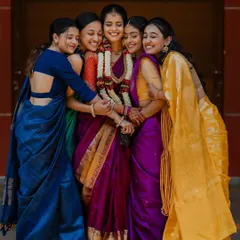 The bride surrounded by her best friends in a warm group hug. This shot captures the love and support of the bride tribe on her special day.