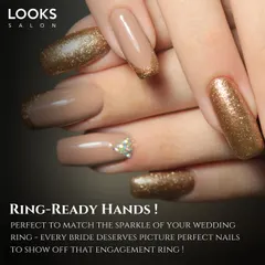 Ring-ready hands are a must for every bride. This image showcases a beautiful bridal manicure with nude polish and gold glitter accents, perfect for showing off that engagement ring.