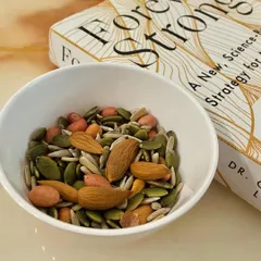 A handful of mixed nuts and seeds is a great snack to have when hunger strikes. It's rich in healthy fats, fiber, and micronutrients like zinc from pumpkin seeds. Plus, it's easy to carry with you anywhere.