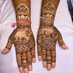 A special design for the groom's sister! This intricate mehendi is packed with traditional elements, including peacocks, elephants, and lotus flowers, fit for a royal celebration.