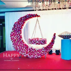 This close-up shows our floral crescent moon cradle design, featuring a mix of pink and white flowers. The cradle is suspended within the moon, ready for the naming ceremony.