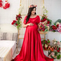 Bold and beautiful in a vibrant red satin gown. This dress has a classic, elegant feel, and the rich color makes a powerful statement. Here it is styled with a floral crown for a touch of softness.