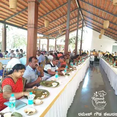 Guests enjoying a traditional 'beegara oota' at an outdoor venue. Our team ensures the quality of food and service is maintained, no matter the location.