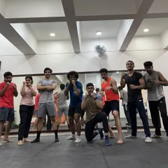 The energy and camaraderie after a great session. Our members take a moment to pose together, showcasing the positive and motivating atmosphere of our academy.
