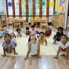 The cobra pose is a favorite among our little yogis! It helps strengthen their backs and opens up their chests, all while pretending to be little snakes.