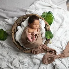 Nestled in a rustic basket and swaddled in earthy tones, this little one looks so serene. I love using natural textures to create a warm and organic feel for my newborn portraits.