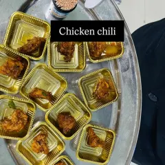 Chicken chili served in single portion cups, making it easy for guests to enjoy while mingling at a birthday party.