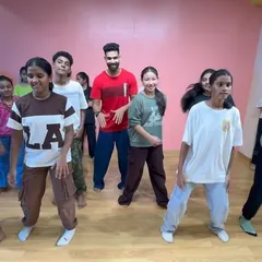 A candid shot of the kids learning a new routine during our dance workshop.