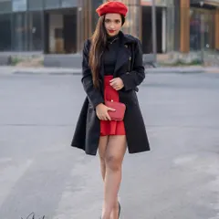 Capturing the chic and effortless 'Emily in Paris' vibe right here on the streets. This shot combines a bold red and black outfit with a modern urban background to create a story of sophisticated style.