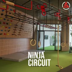 Our Ninja Circuit area at AoS Whitefield, complete with a climbing wall, monkey bars, and ropes. It's a space designed for you to challenge your strength and agility in new ways.