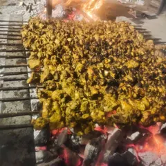 This is how we do it for big events. A huge grill full of chicken kebabs, cooked live over hot coals. The smell alone will make your guests hungry.