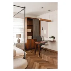 We seamlessly integrated a sleek, functional workspace into the master bedroom, complete with a pinboard and ample storage.