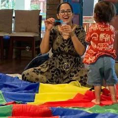 That pure joy when the bubbles come out! Simple props like bubbles and our big, colourful parachute create moments of wonder and encourage visual tracking and movement. It’s a happy, gentle way to engage with the world.