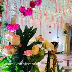 A close-up of the fresh flowers used in one of my arrangements. I use a mix of roses and other seasonal blooms to create a soft, romantic look, with traditional dolls adding a cultural touch.