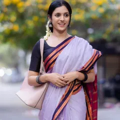 A happy and radiant look in our lavender Ilkal saree. We styled it with a simple black blouse and fresh jasmine flowers for a classic, timeless appeal.