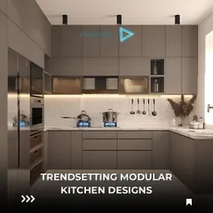 A look at a trendsetting modular kitchen in a sophisticated grey. This design features handleless cabinets for a sleek look, integrated appliances, and under-cabinet lighting to illuminate the workspace.