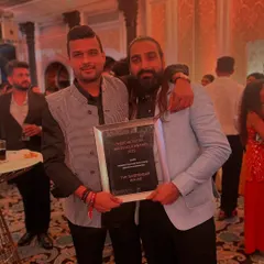 Posing with my award. This win belongs to every client who trusted me and every team member who has worked tirelessly to build our reputation.