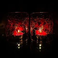 Here, I used a vibrant red floral design on these lamp chimneys. When lit, they cast a warm, inviting light that highlights the intricate details of the painting.