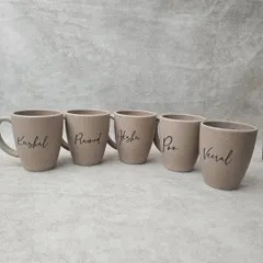 For an eco-conscious choice, I offer these coffee mugs made from bamboo husk. They are durable, lasting up to 3000 washes, and can be personalized with a name in a beautiful script font.