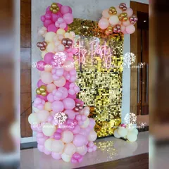 This glamorous photo corner was the centerpiece of a boho-themed Annaprashan ceremony. The gold sequin wall and "Let's Party" neon sign provided a modern contrast to the traditional event, creating a fun space for family photos.