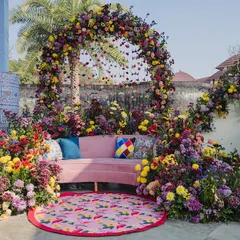 When a bride requested "no marigolds," we created this vibrant, blooming oasis for her Haldi. We used a riot of fresh spring florals, playful prints, and layered textures to design a modern and joyful setting that felt completely unique.