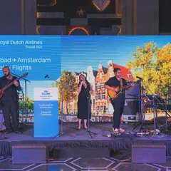 A shot of the full band on stage for a KLM Royal Dutch Airlines corporate event. This shows our professional setup for large-scale events, complete with custom branding. We ensure a polished, high-quality production every time.