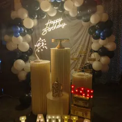 I love how this modern and stylish birthday theme turned out. The decoration features a full balloon arch in black, white, and blue, a personalized neon sign, and marquee letters for the name "LATHA", all arranged neatly with my set of pedestals and props.