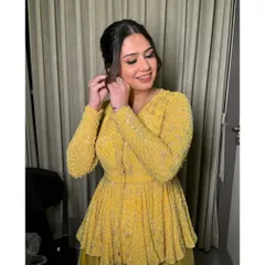 Radiant in yellow for Diwali festivities. This look is bright and glowing, with a soft smokey eye and a pretty, textured ponytail.
