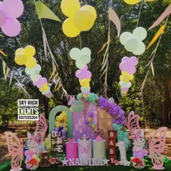 A beautiful butterfly garden theme for Nainika's first birthday. This outdoor setup features large butterfly wing cutouts, pastel balloons, and a whimsical feel.