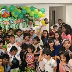 A group photo with all the kids and guests after a fantastic birthday magic show. Look at all those happy, smiling faces.