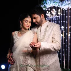 For this evening engagement, I ensured the groom's makeup was photo-ready, eliminating any shine under the lights while maintaining a natural, masculine appearance in his ivory sherwani.