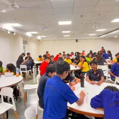 Students engaged in a collaborative writing activity at our Prometheus School workshop. We make learning fun, interactive, and team-oriented.