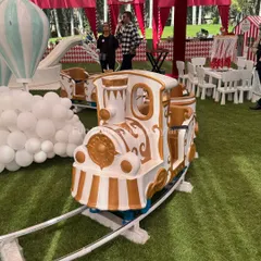 Our elegant white and gold Fun Express train, a centerpiece attraction perfect for circus, carnival, or royal-themed birthday parties. This ride is a guaranteed hit, providing magical moments for children as it circles the track.