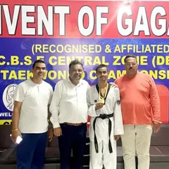 Celebrating Ansh Sharma's gold medal win at the CBSE Central Zone championship with officials. It's a proud moment for the entire academy.