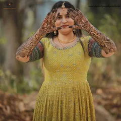 A beautiful portrait of a bride showcasing her intricate Mehndi design. We make sure to capture the artistry of the henna before the main wedding day celebrations begin.
